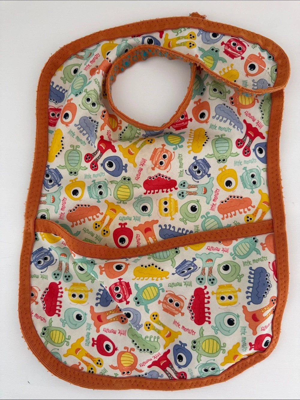 Kids Orange Trim Baby Bib with Colorful Monster Print